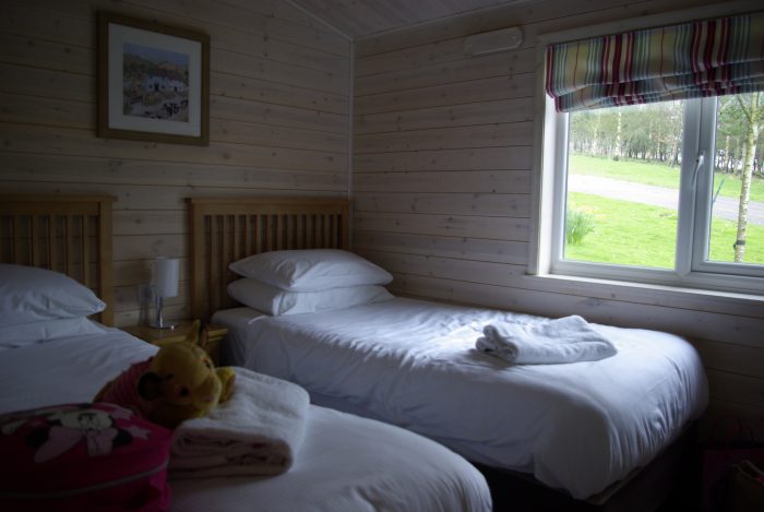 One of the twin bedrooms in lodge 65 Sandybrook Country Park