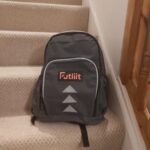 A review of the Futliit LED backpack. The photo shows the rucksack on a staircase.