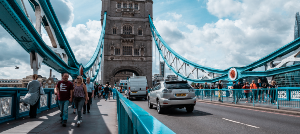 Tower Bridge London with traffic and people walking over it